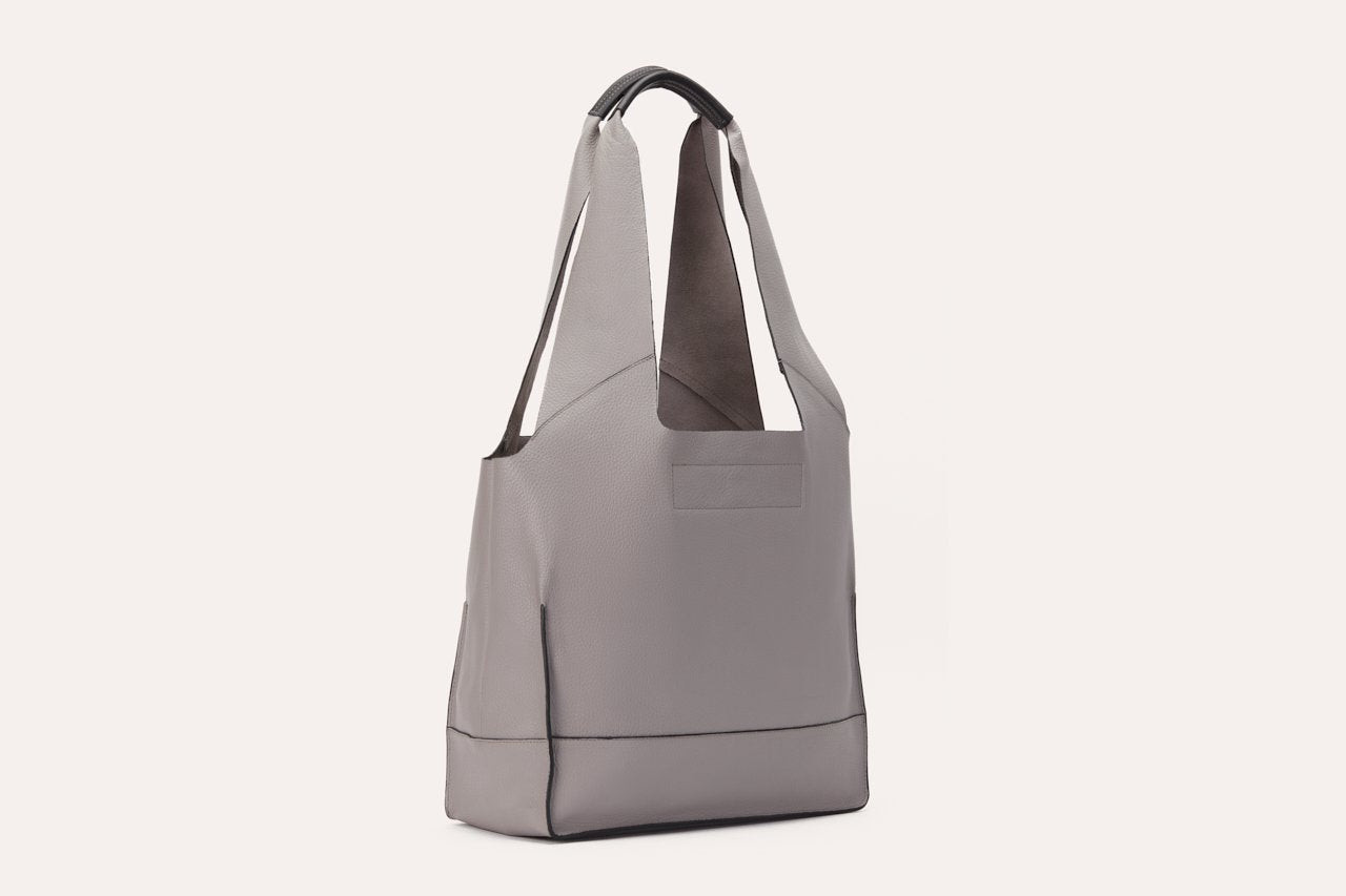 Pink Lucy modern tote bag made of durable accessories material, with sleek design and top handles, ideal for everyday use.