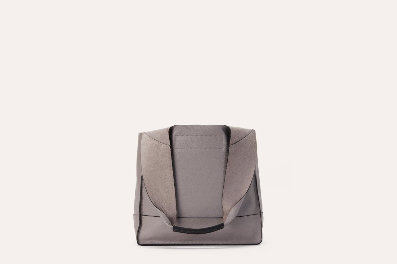 Pink Lucy modern tote bag, stylish accessory with sleek design, featuring sturdy handles and spacious interior for everyday use.