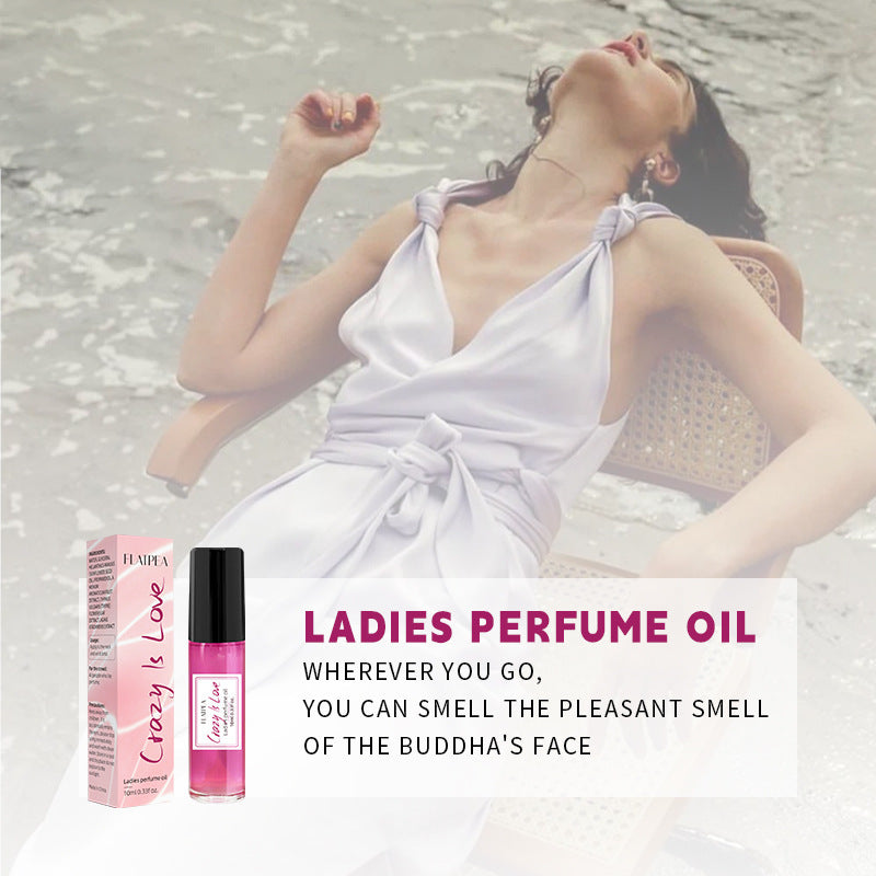 Carmine Juneberry Crazy In Love™ body perfume oil for women, featuring a stylish bottle with floral and fruity design elements.