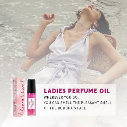 Carmine Juneberry Crazy In Love™ body perfume oil for women, featuring a stylish bottle with floral and fruity design elements.