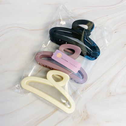 Set of three Fuchsia Hercules hair claw hair accessories with sleek, modern design for stylish hair styling.