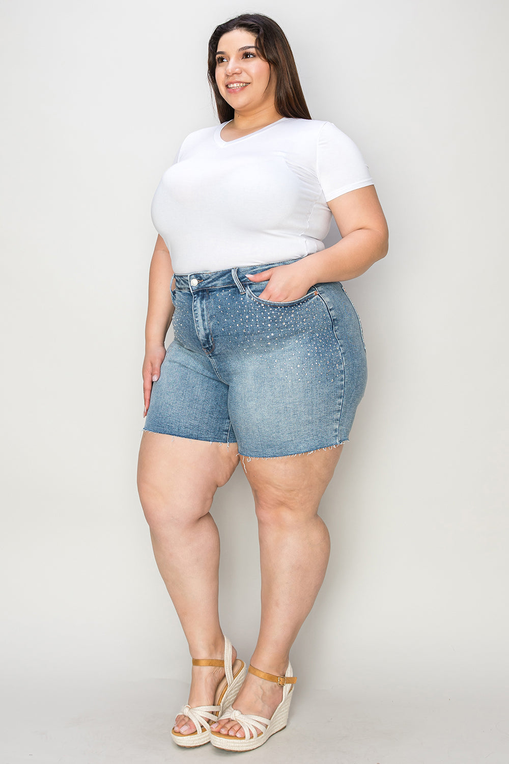 High-waist denim shorts with rhinestone decor, styled for a fashionable look by Judy Blue, featuring detailed embellishments.