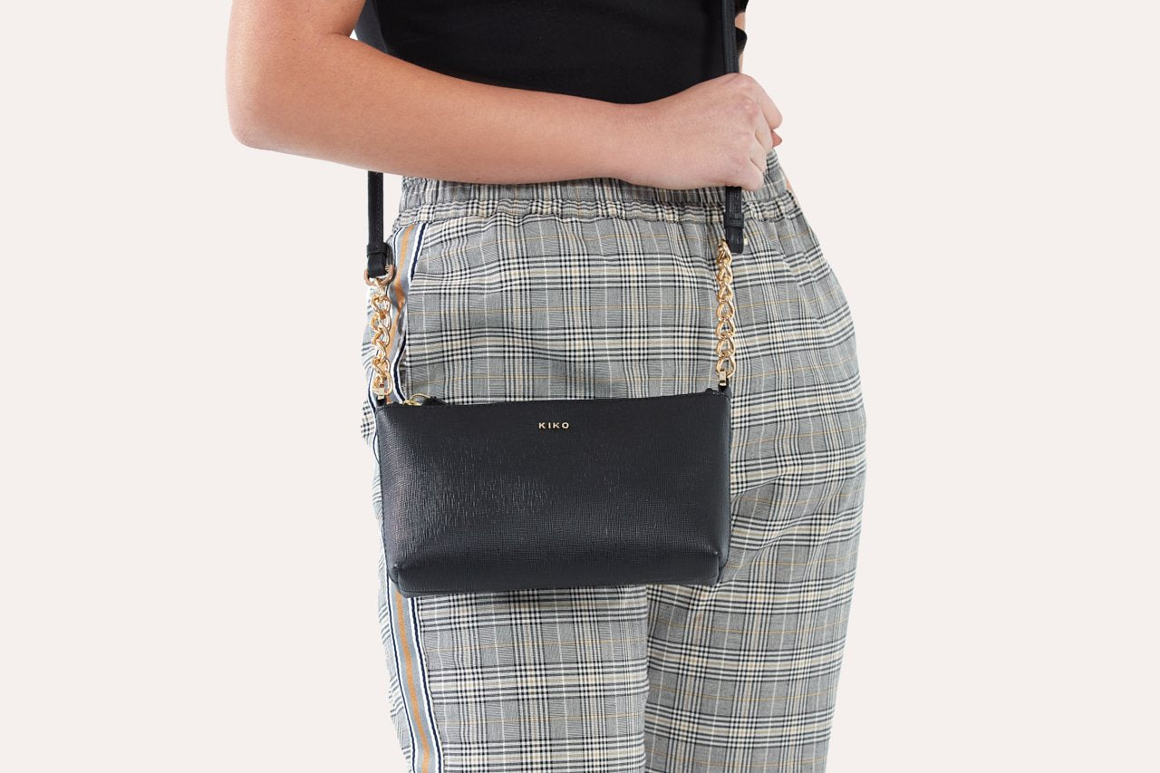 Pink Lucy two-chain crossbody bag with silver hardware, featuring a sleek design and adjustable strap.