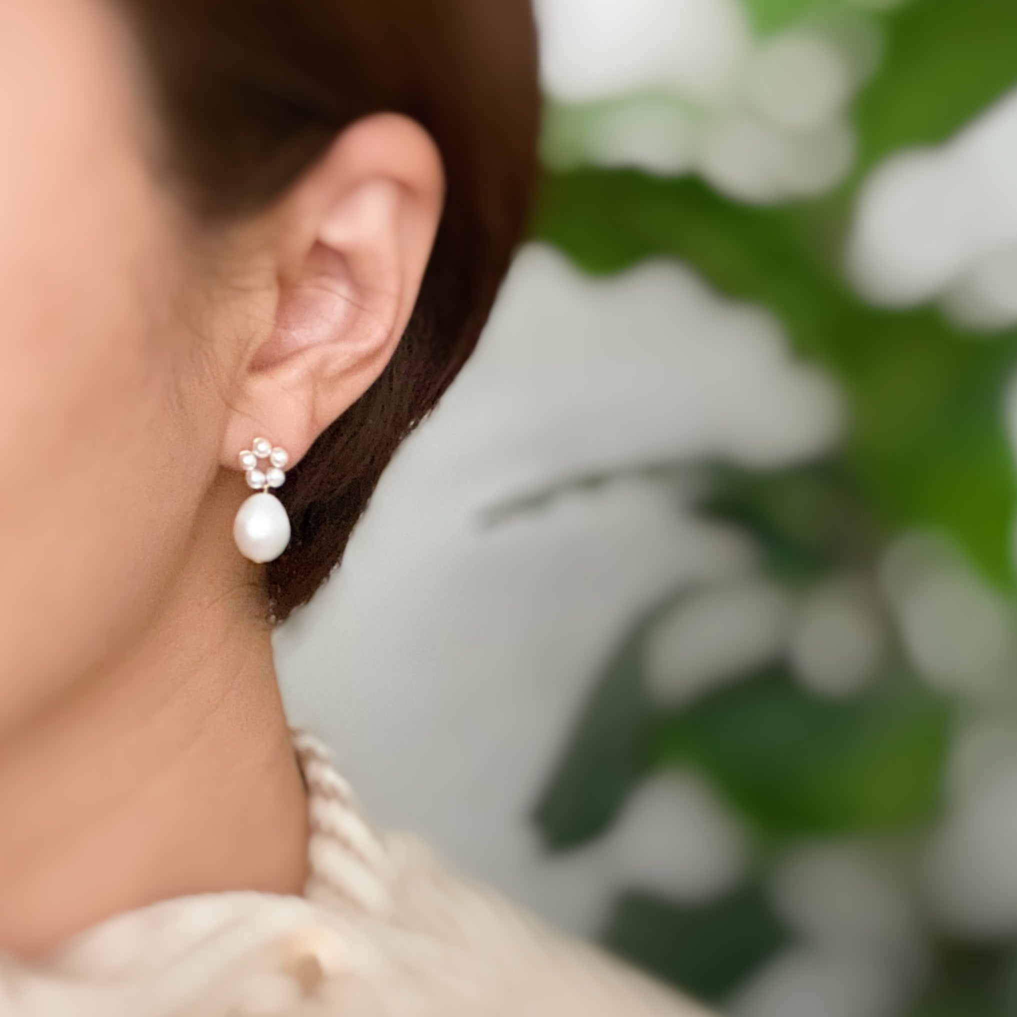 Fuchsia Hercules freshwater pearl drop earrings with elegant jewelry design, showcasing dangling pearls on silver hooks.