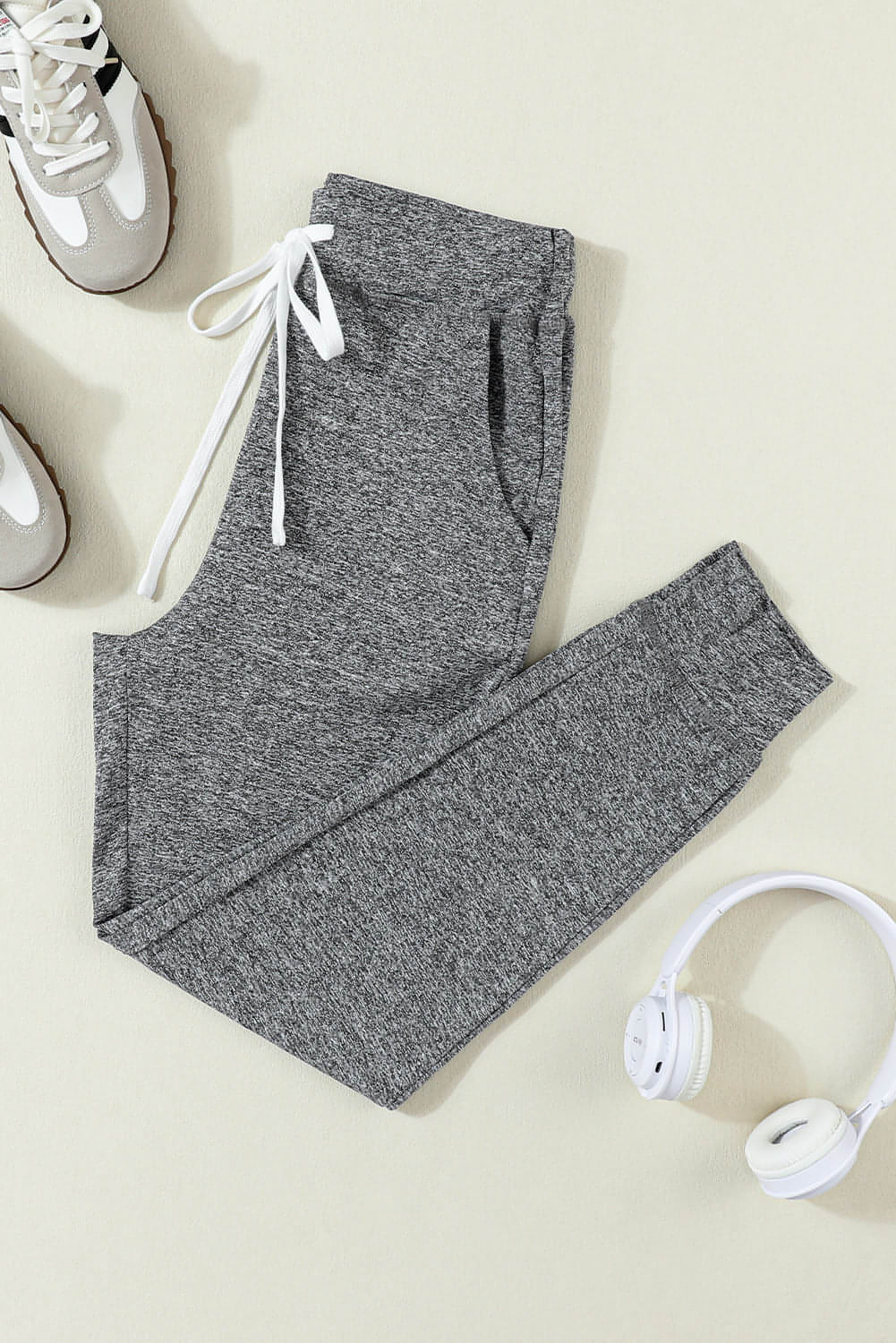 Gray Carmine Juneberry joggers with drawstring waist and side pockets, casual athletic pants for comfortable wear.