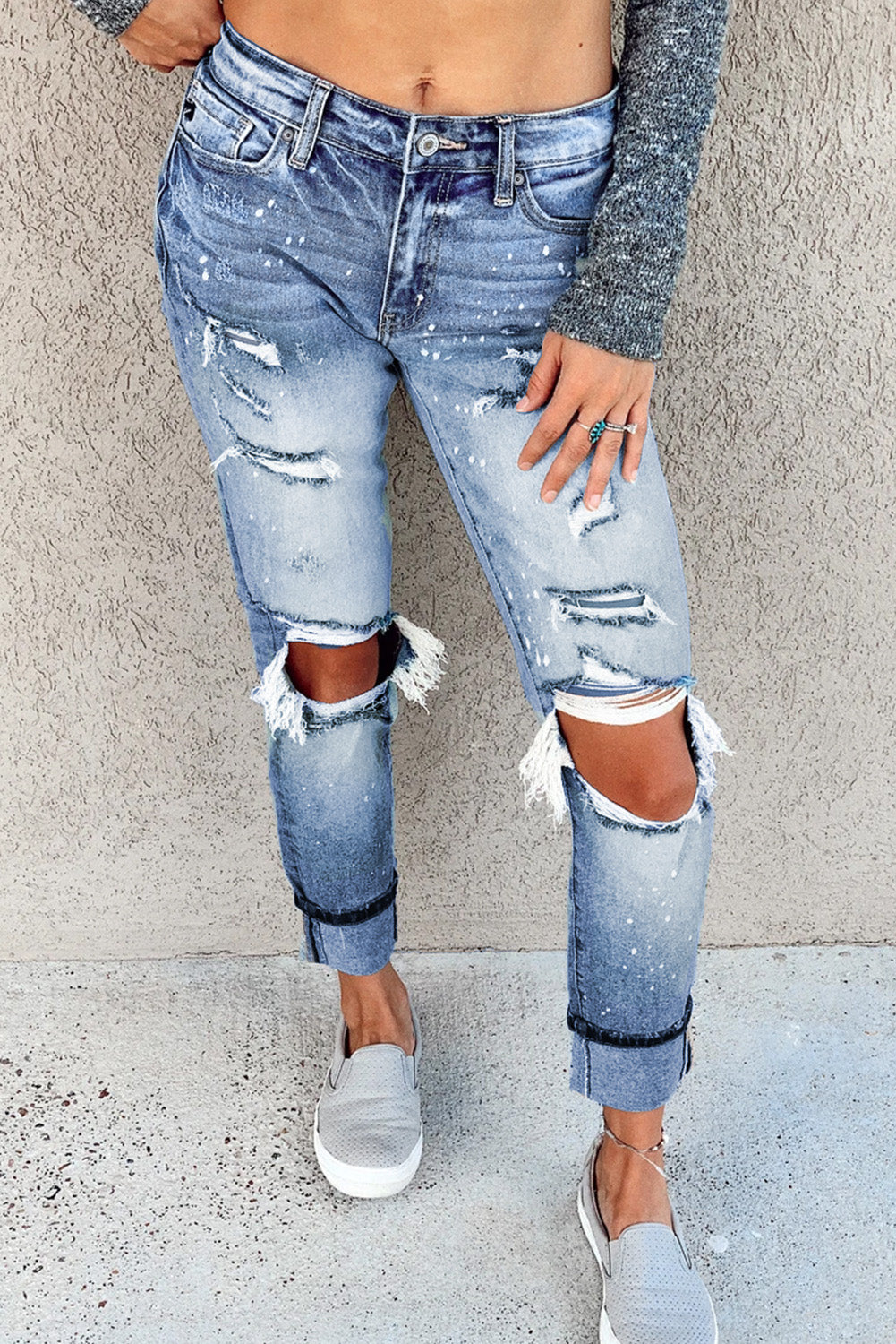 Light blue ripped straight leg jeans for women by Lavender Pallas, showing distressed denim with a relaxed fit.
