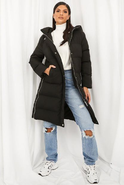 Black Rose Eleusis hooded longline puffer coat with a high collar, insulated for warmth, displayed on a hanger.
