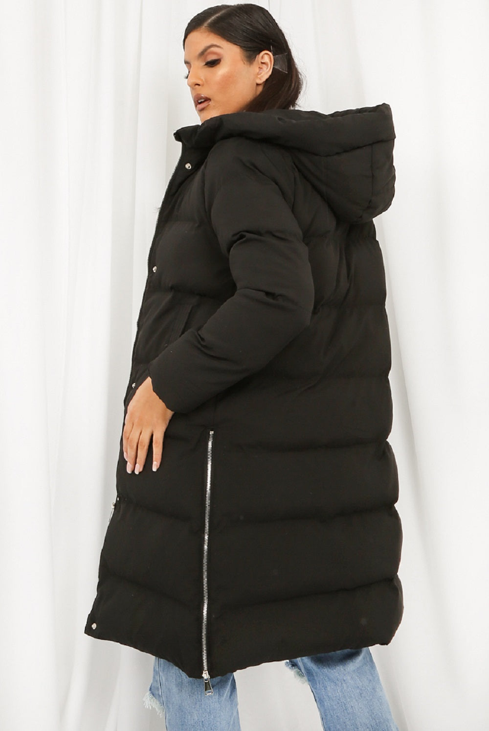 Black hooded longline puffer coat by Rose Eleusis, stylish winter jacket with quilted design and cozy hood.