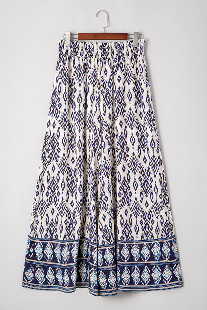 Byzantium Bay boho smocked high waist wide-leg pants for women, featuring flowy fabric and relaxed fit.