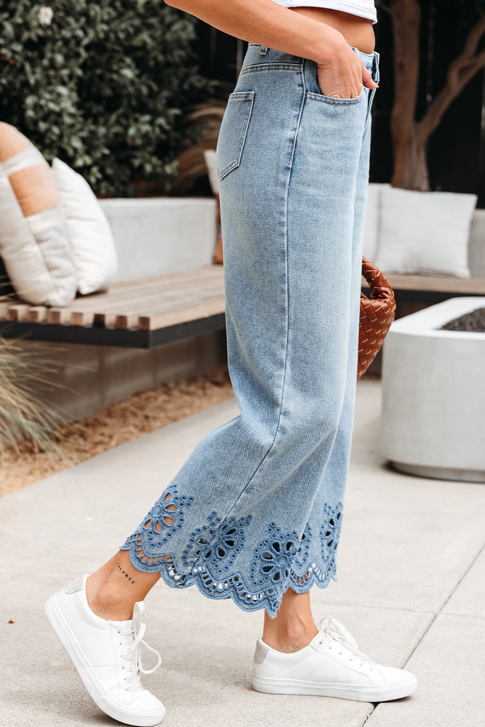 Byzantium Bay solid denim embroidered wide leg jeans with detailed floral embroidery and relaxed fit.
