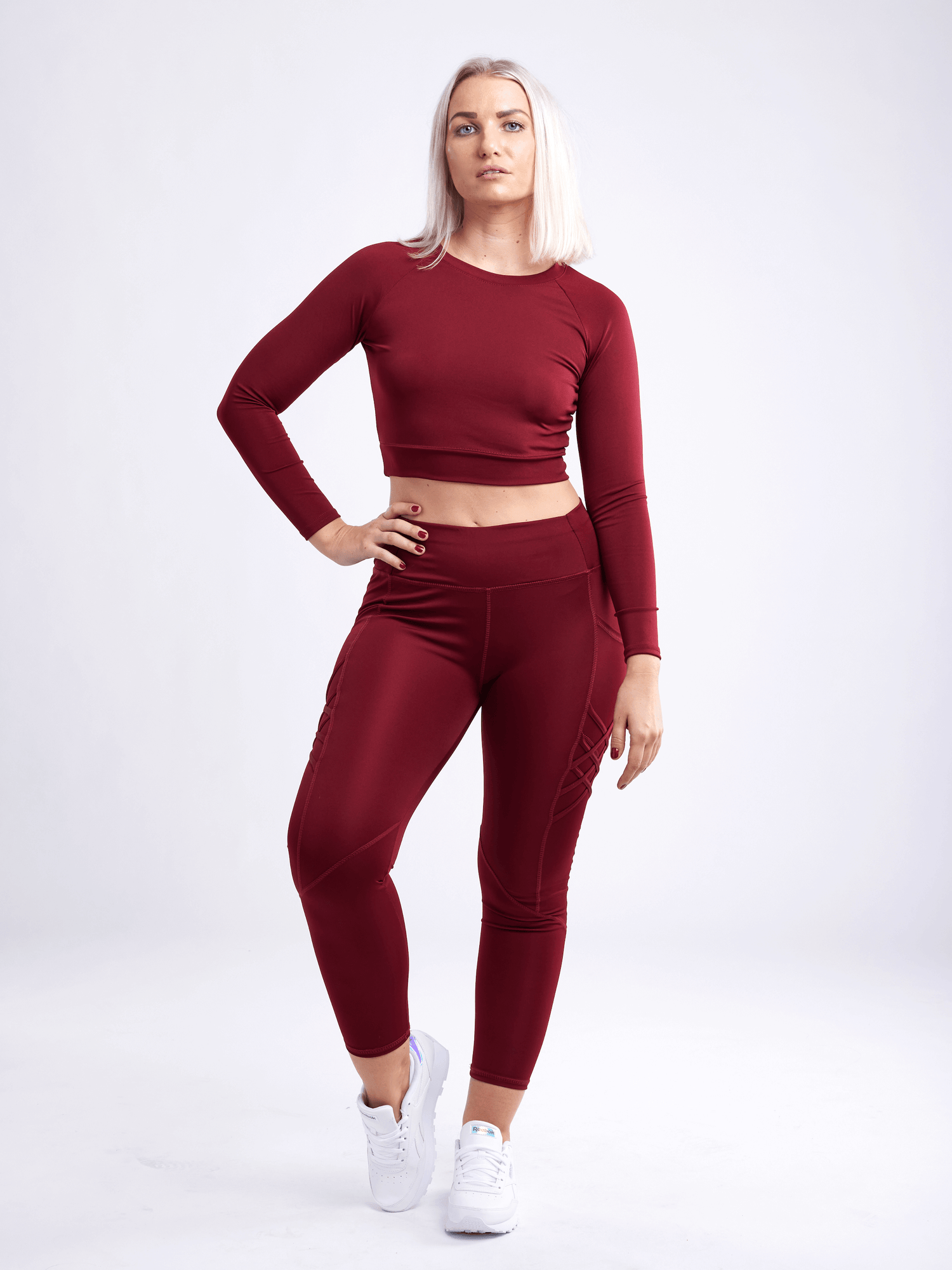 Black Lavender JupiterGear long-sleeve crop top for activewear, shown in black with fitted design and thumbholes.