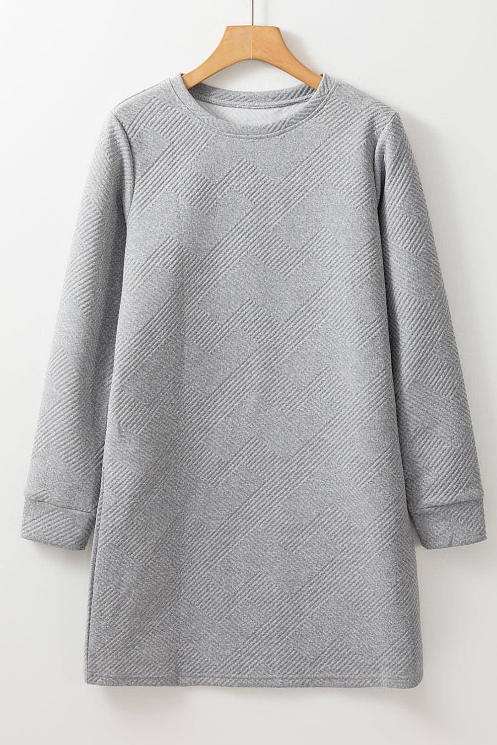Gray solid color textured long sleeve shift dress by Carmine Juneberry, shown on a mannequin with a simple background.