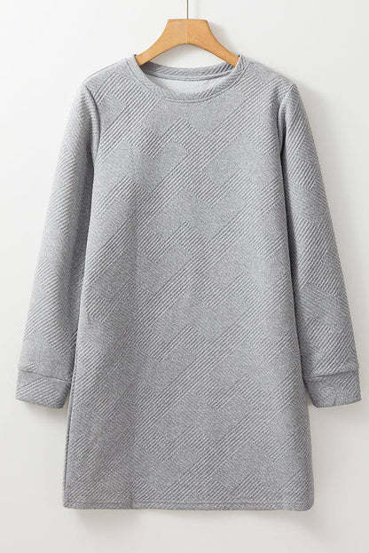 Gray solid color textured long sleeve shift dress by Carmine Juneberry, shown on a mannequin with a simple background.