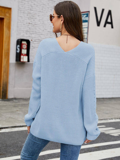 Carmine Juneberry V-neck rib-knit top, soft fabric with long sleeves and fitted silhouette, stylish and comfortable for casual wear.