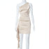 Carmine Juneberry sleeveless slim fit crossbody dress hanging on a mannequin, showcasing a modern, fitted design in a neutral color.