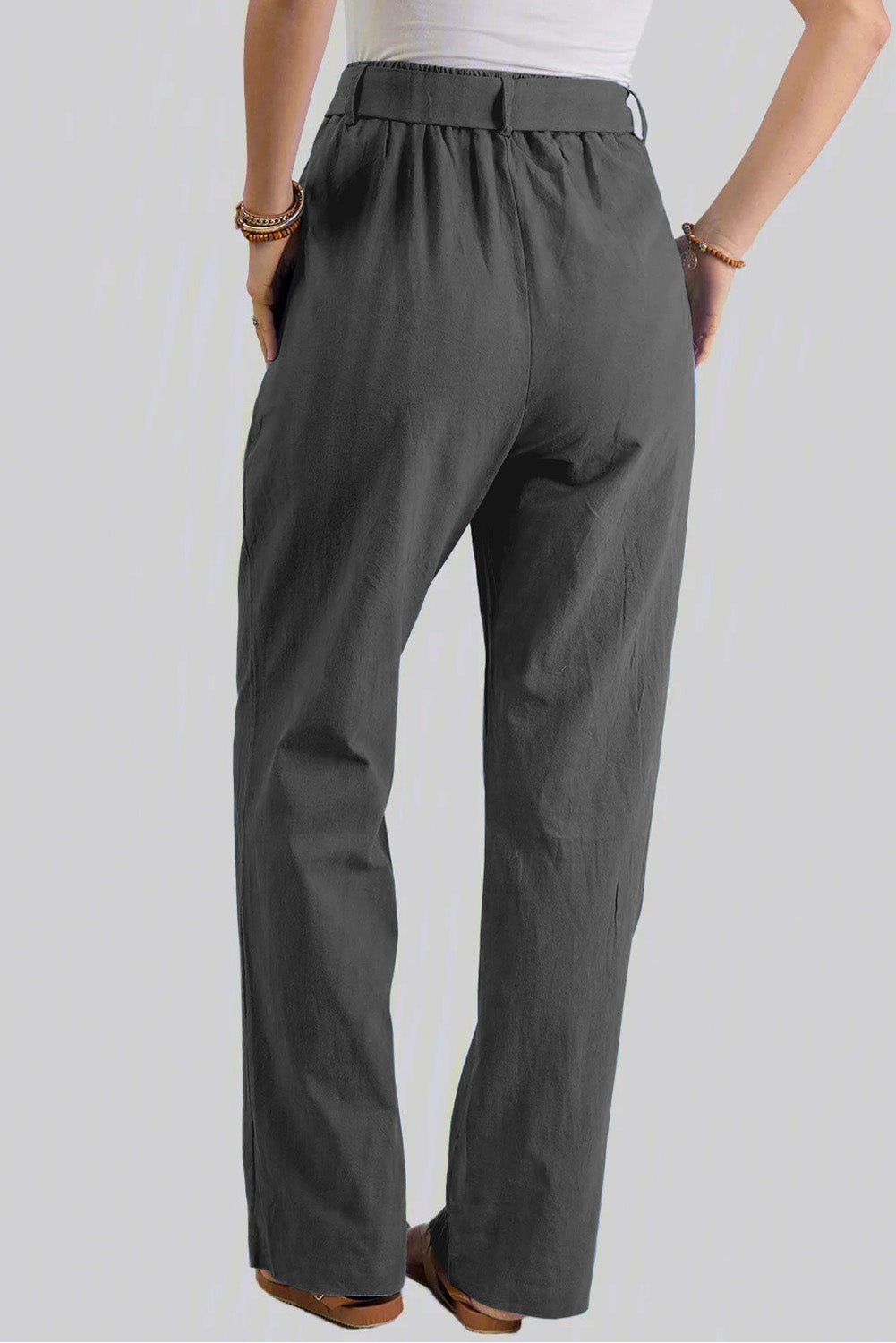 Black elastic waist drawstring wide-leg pants from Harlequin Daisy, designed for comfort and style in bath and beauty wear.