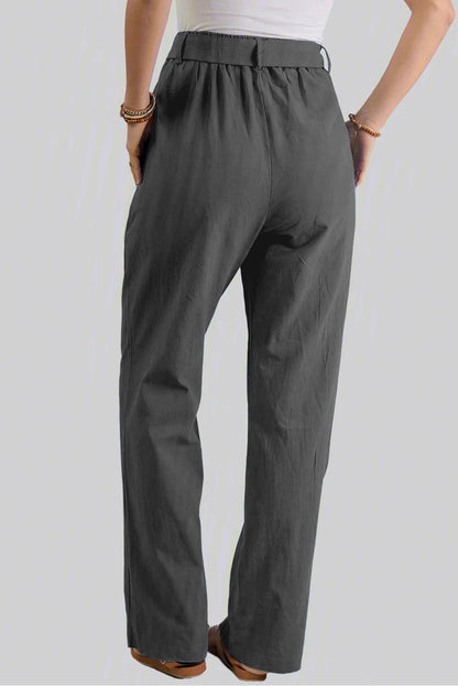 Black elastic waist drawstring wide-leg pants from Harlequin Daisy, designed for comfort and style in bath and beauty wear.