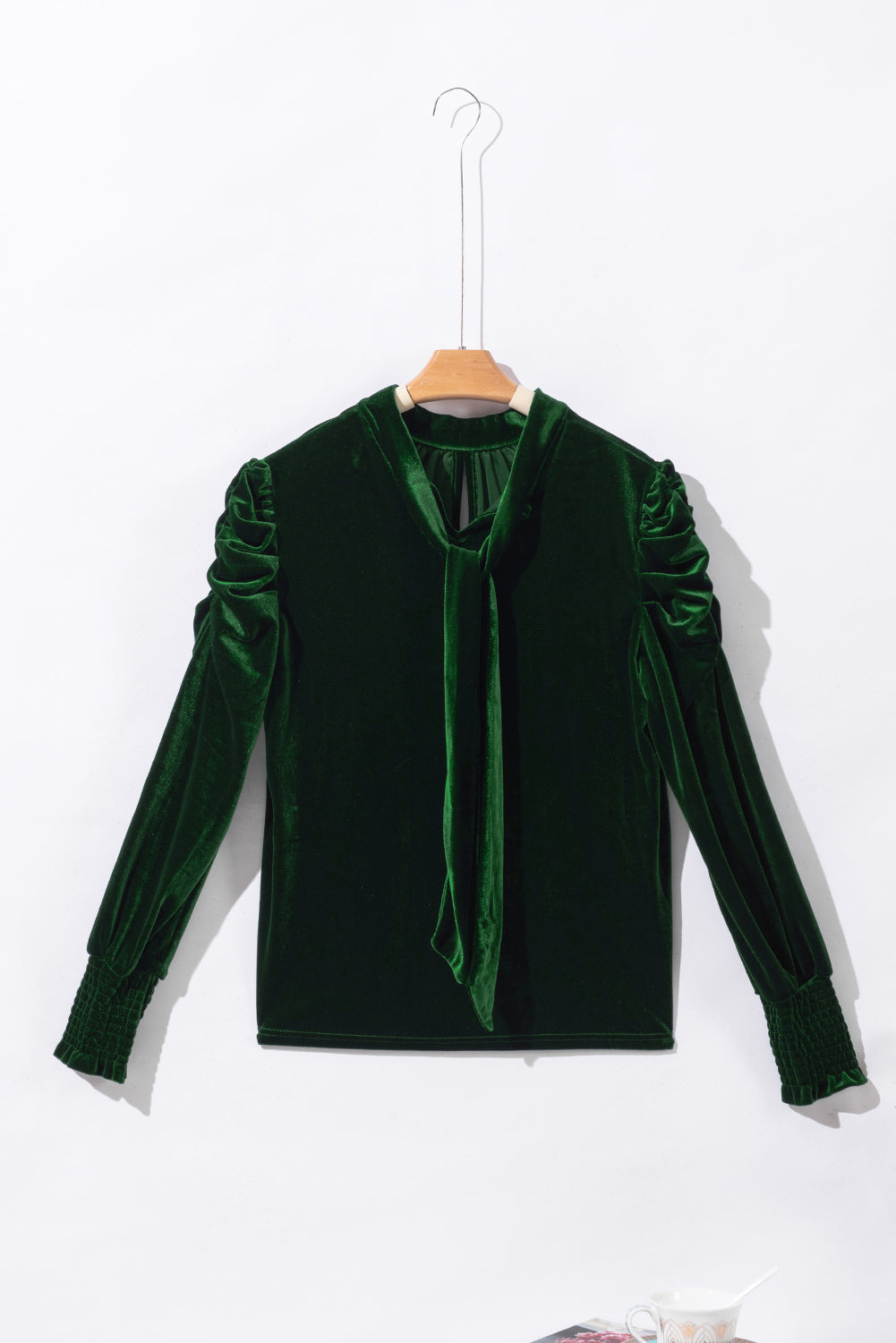 Blackish green velvet puff sleeve mock neck blouse by Carmine Juneberry, shown with stylish puffed sleeves and a fitted mock neckline.
