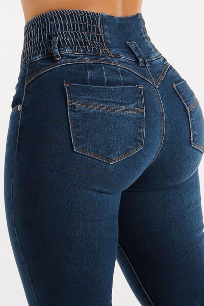 Taupe Oliver high waist buttoned skinny jeans with hip lifting design, showcasing their fitted style and curve-enhancing fit.