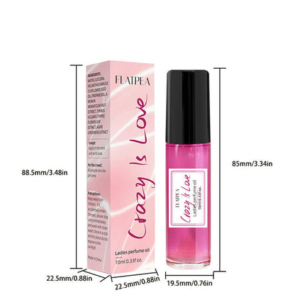 Carmine Juneberry Crazy In Love™ body perfume oil for women, featuring a sleek bottle and elegant packaging for luxurious body care.
