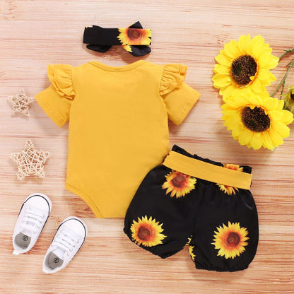 Carmine Juneberry SunnyBloom™ baby girl sunflower outfit set with a floral dress, matching headband, and bloomers.