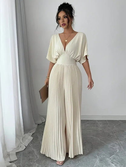 Carmine Juneberry pleated wrap-style maxi dress in 25th edition, featuring flowing fabric and elegant design.