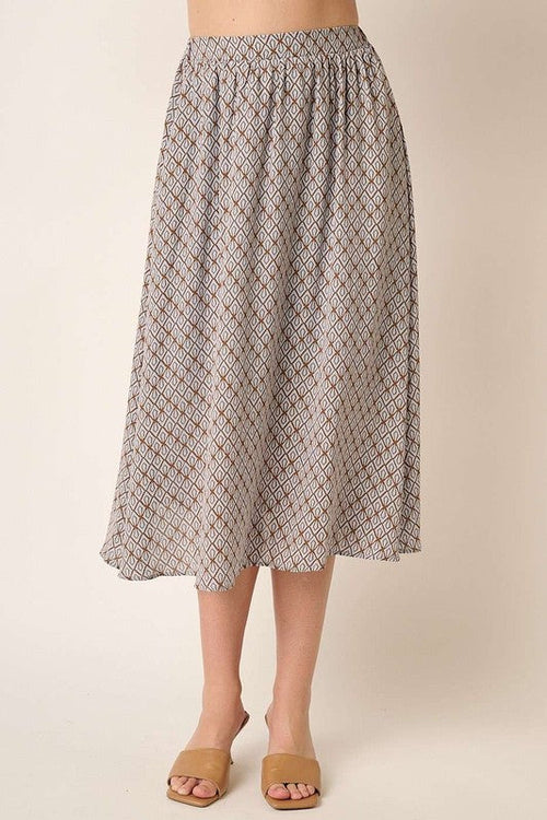 Automotive-themed printed midi skirt by Jade Icarus, featuring bold design and stylish length, displayed on a model.