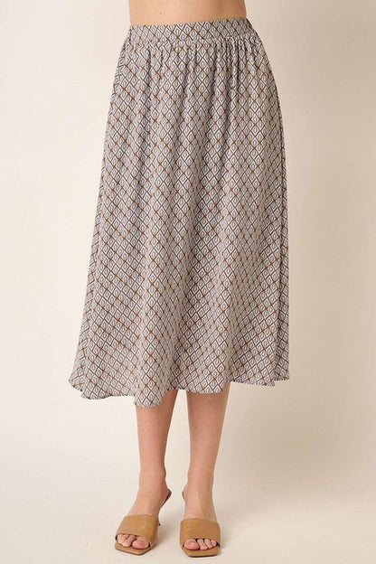 Automotive-themed printed midi skirt by Jade Icarus, featuring bold design and stylish length, displayed on a model.
