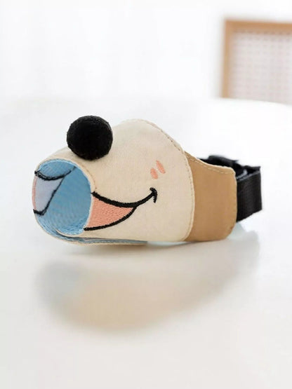 Pear Daisy anti-bite dog muzzle in black, designed to prevent biting and ensure safety during walks or grooming.
