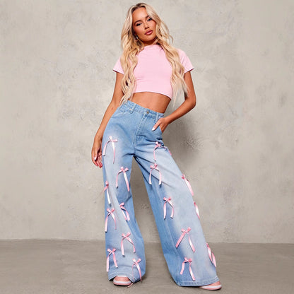 Carmine Juneberry Bow High Waist Wide Leg Jeans in blue denim, featuring a high waist and wide-leg fit for a stylish look