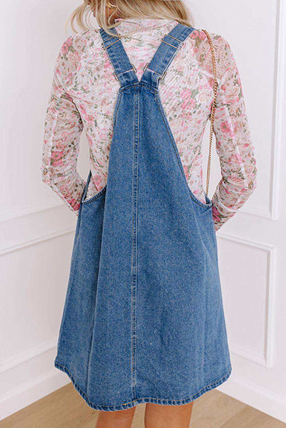 Dusk blue Carmine Juneberry denim mini dress with wide straps, button front, and front pocket details.
