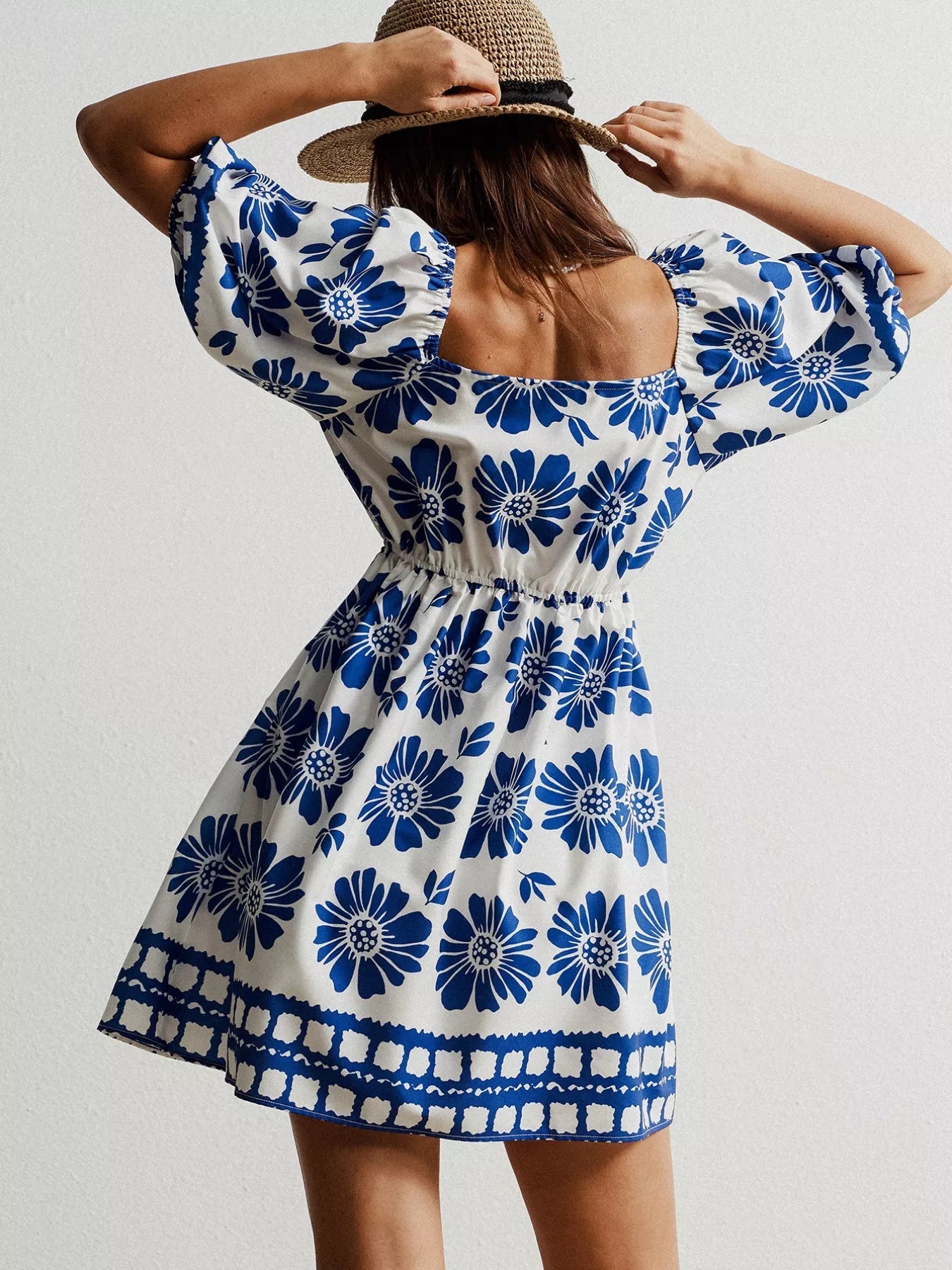 Pear Daisy floral print puff sleeve mini dress with a vibrant floral pattern, perfect for casual summer wear.
