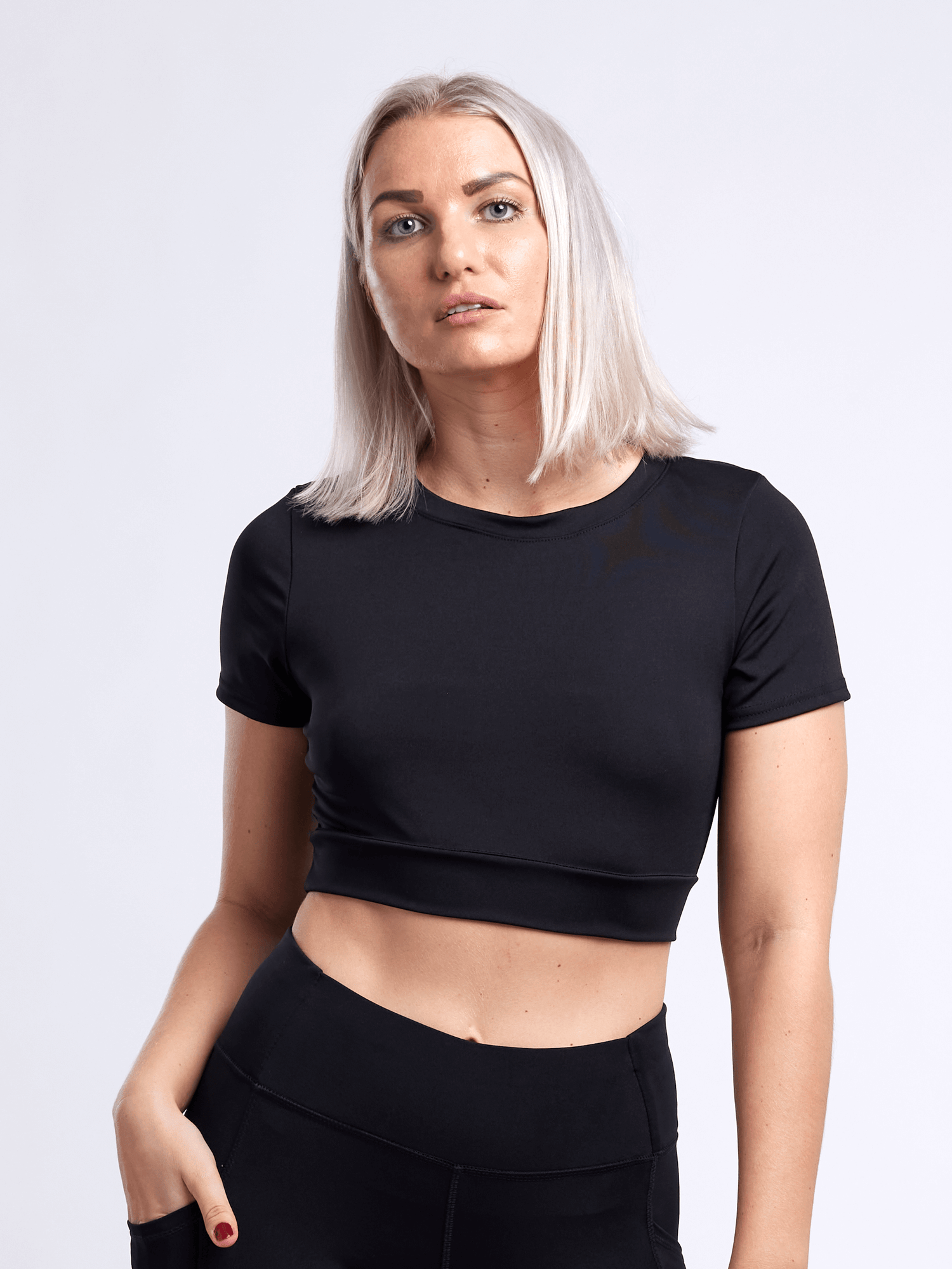 Black Lavender JupiterGear short-sleeve crop top, activewear for women, shown on a mannequin with a sporty design and comfortable fit.