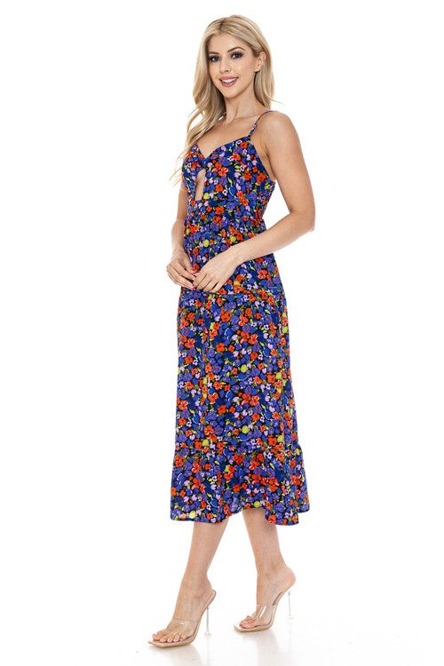 Women’s floral maxi dress by Jade Icarus, flowing fabric with vibrant flower patterns, perfect for summer or casual wear.