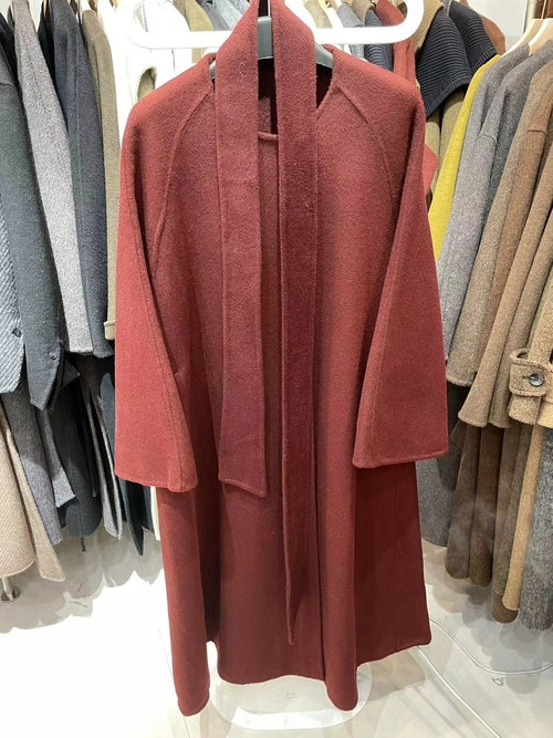 Women’s reversible cashmere coat by Carmine Juneberry, showcasing elegant winter style with soft, luxurious fabric and versatile design.