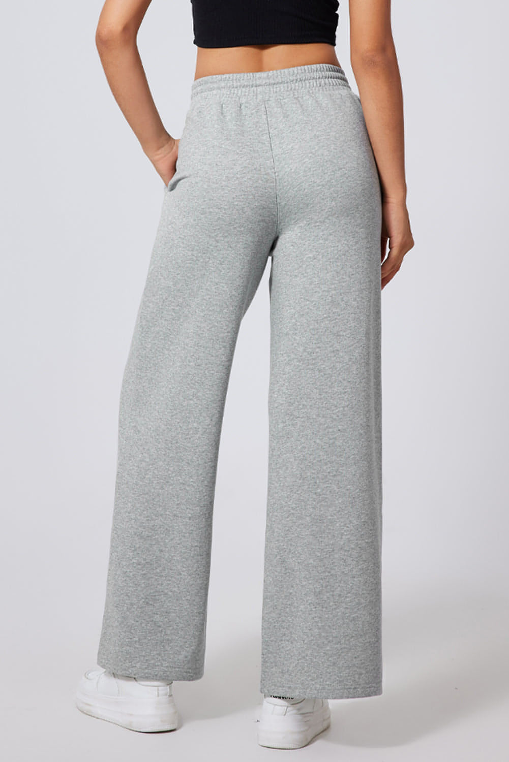 Gray seamed high waist wide-leg sweatpants by Carmine Juneberry with drawstring waist and relaxed fit.