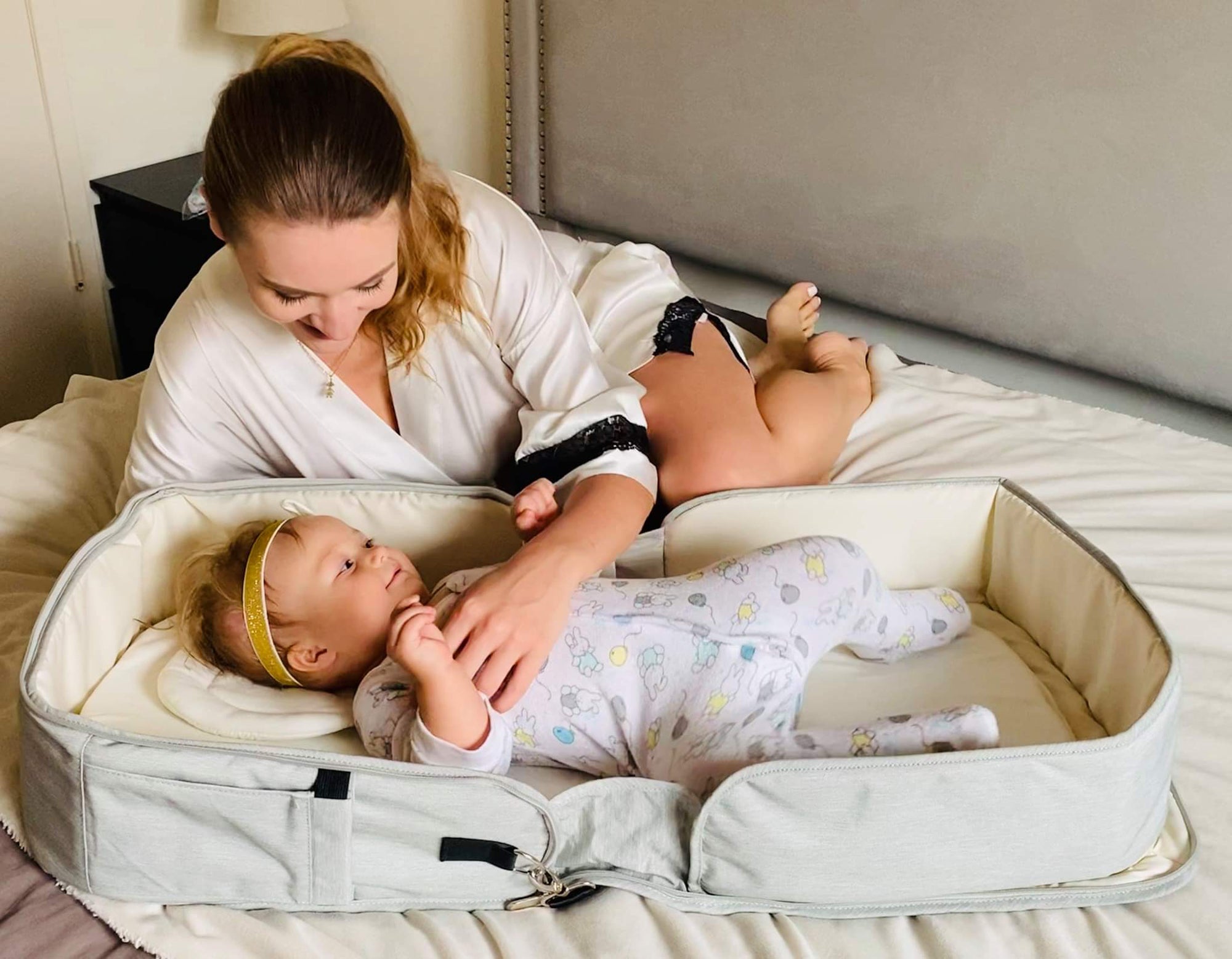 Emerald Clover diaper bag with foldable changing table, designed for kids and babies, featuring multiple compartments and comfortable straps.