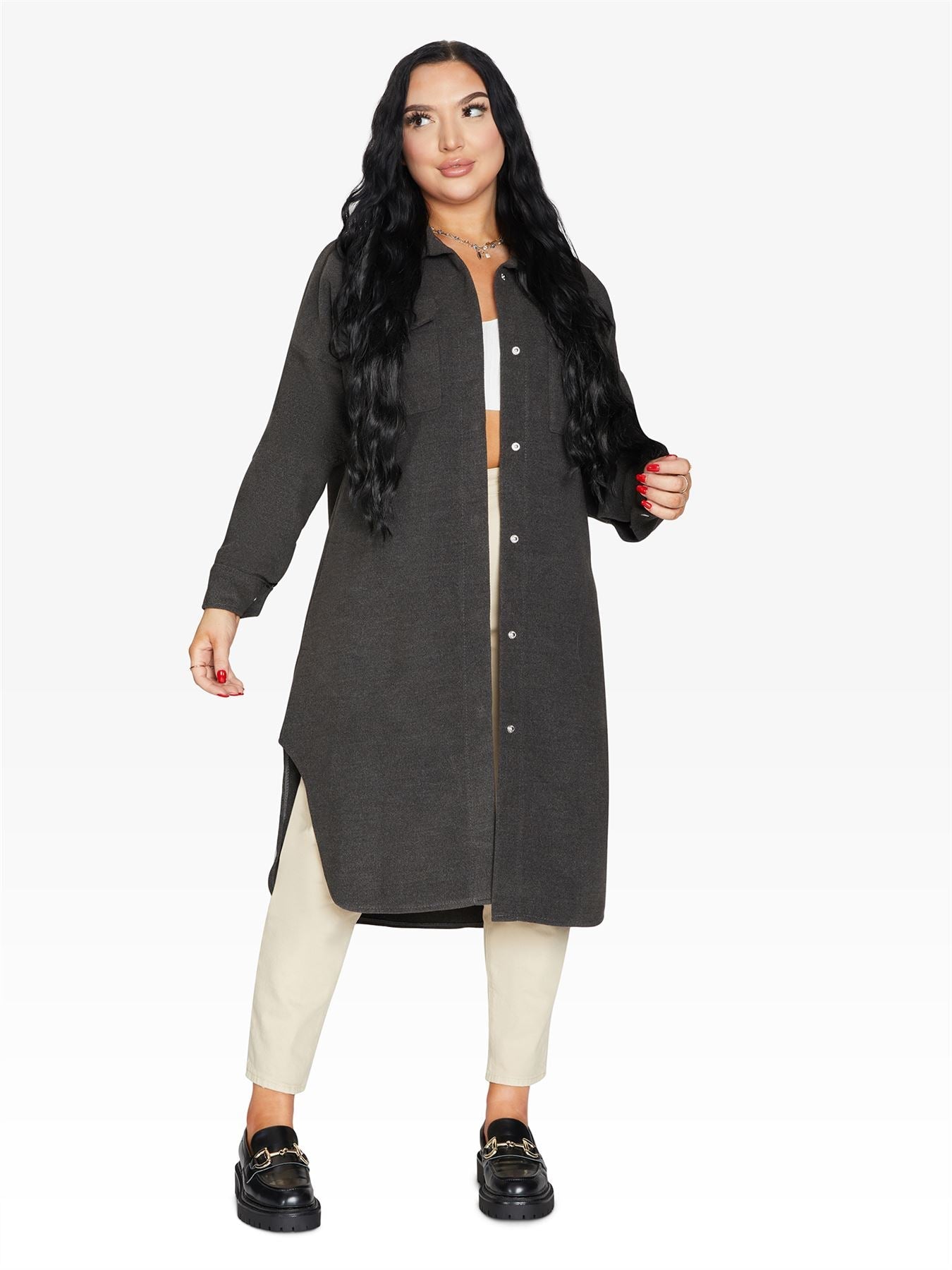 Rose Eleusis oversized longline shacket in neutral fabric, displayed on a hanger showcasing its relaxed fit and stylish design.