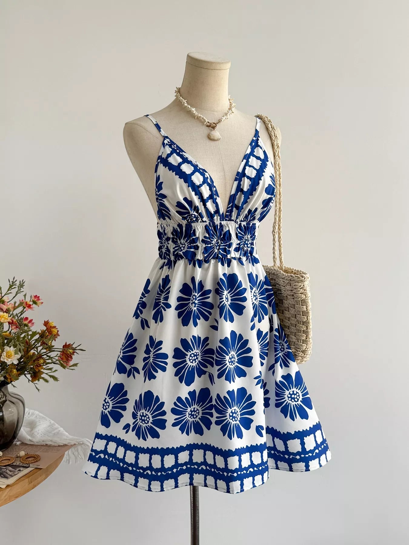 Floral print V-neck mini dress from Pear Daisy featuring a vibrant garden-inspired pattern and lightweight fabric.