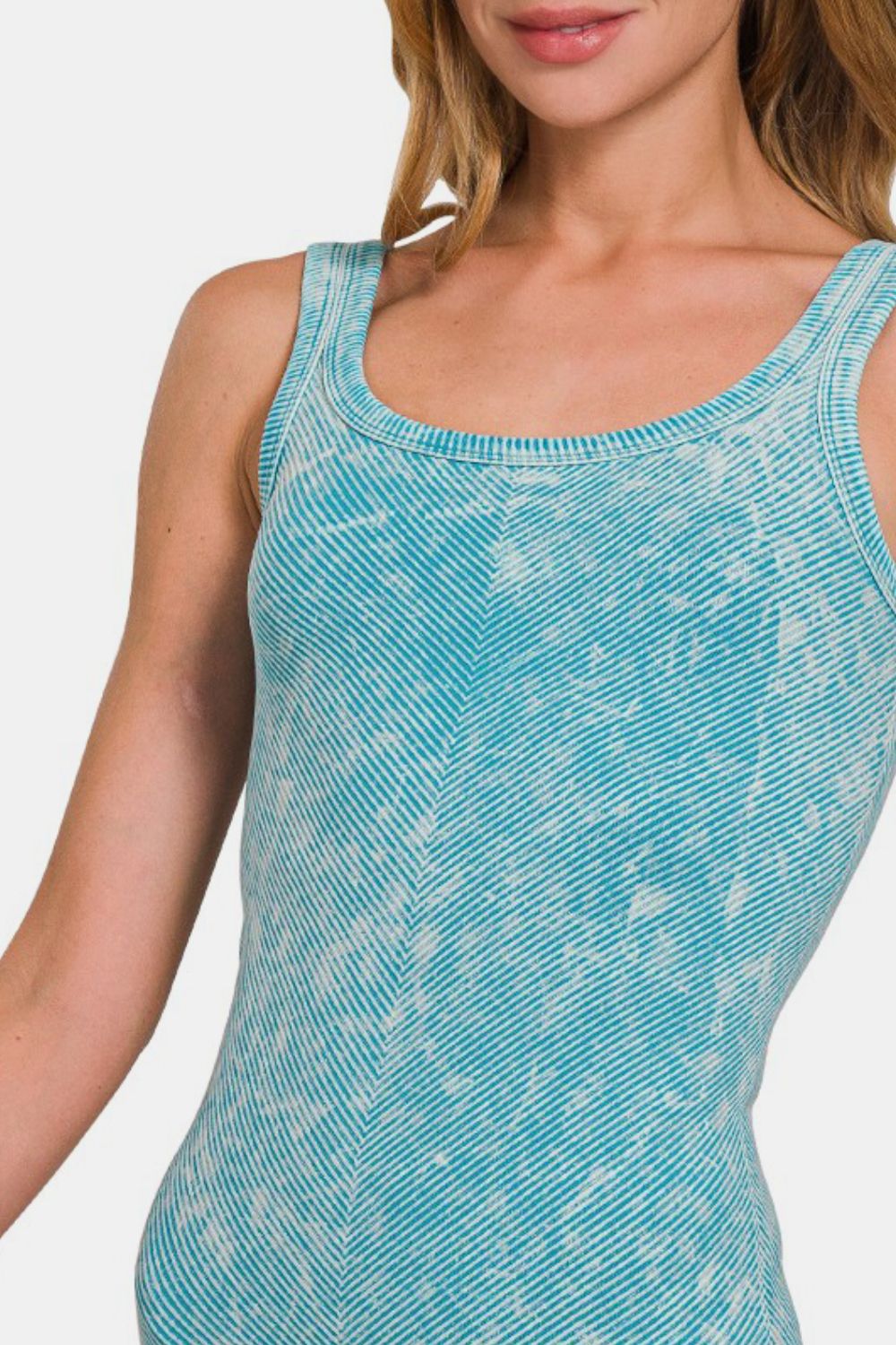 Ribbed scoop neck tank by Jade Icarus, featuring automotive-inspired design, shown in a close-up image with textured fabric.