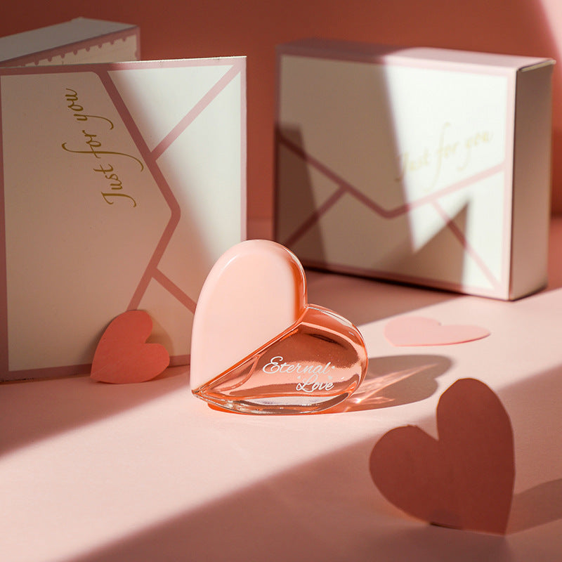 Carmine Juneberry First Love Paris bodycare product with elegant packaging and floral design, showcasing luxurious body scent.