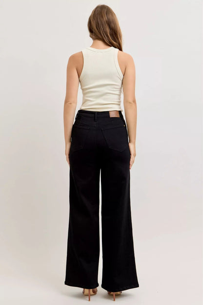 Pear Daisy Judy Blue high-waisted wide-leg jeans displayed on a model, showcasing relaxed fit and stylish denim design.