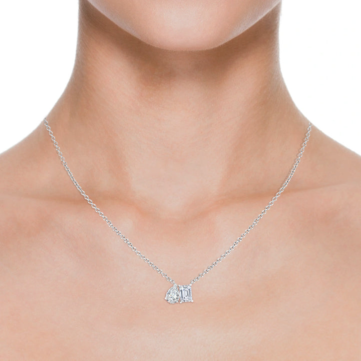 AGI Certified lab-grown emerald-cut and pear diamond two-stone pendant in 14K white gold, featuring 1ctw or 2ctw diamonds.