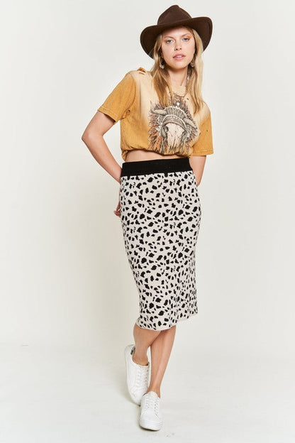 Women’s animal print sweater skirt by Jade Icarus, featuring a stylish animal pattern and cozy knit fabric.
