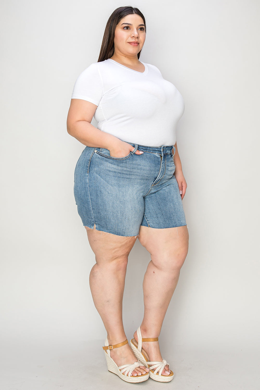 Judy Blue high waist raw hem denim shorts in full size, styled with a casual fit and distressed detailing.