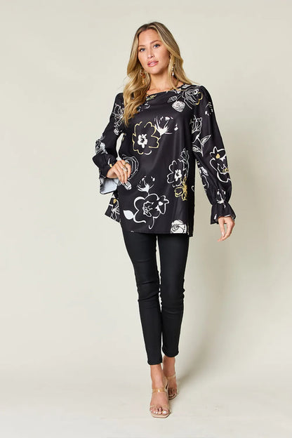 Printed flounce sleeve blouse by Pear Daisy, featuring a stylish full-size design with colorful patterns on a light fabric.