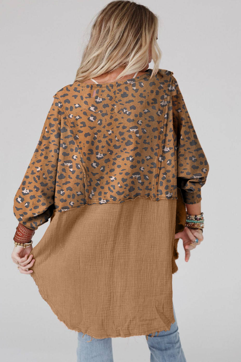 Brown printed raw edge leopard patchwork oversized blouse by Carmine Juneberry, showcasing unique design and raw hem details.