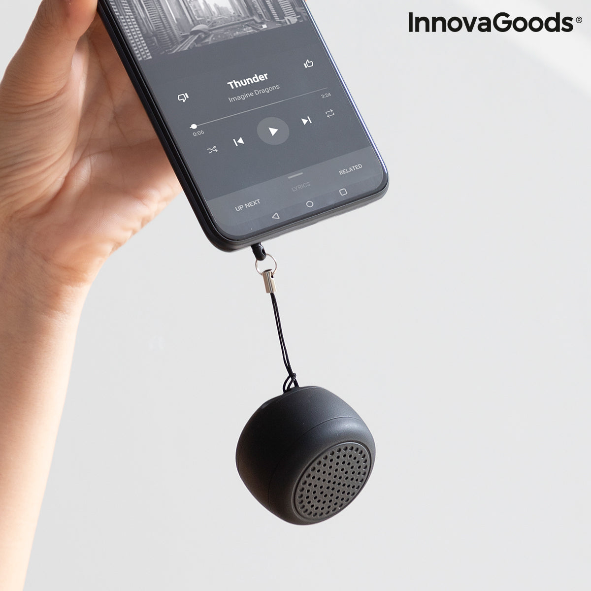 Rechargeable portable wireless mini speaker by Miund InnovaGoods in black, showing compact design and control buttons on top.