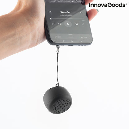 Rechargeable portable wireless mini speaker by InnovaGoods, showing compact design with control buttons and speaker grille.