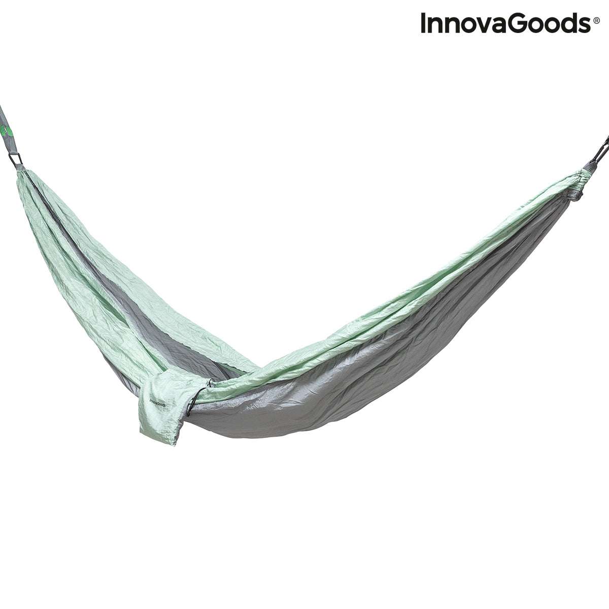 Rewong InnovaGoods double camping hammock, shown hanging between trees, made of durable fabric for outdoor relaxation.